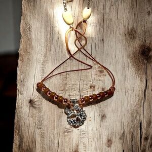 Brown Beaded Necklace with Silver Pendant
